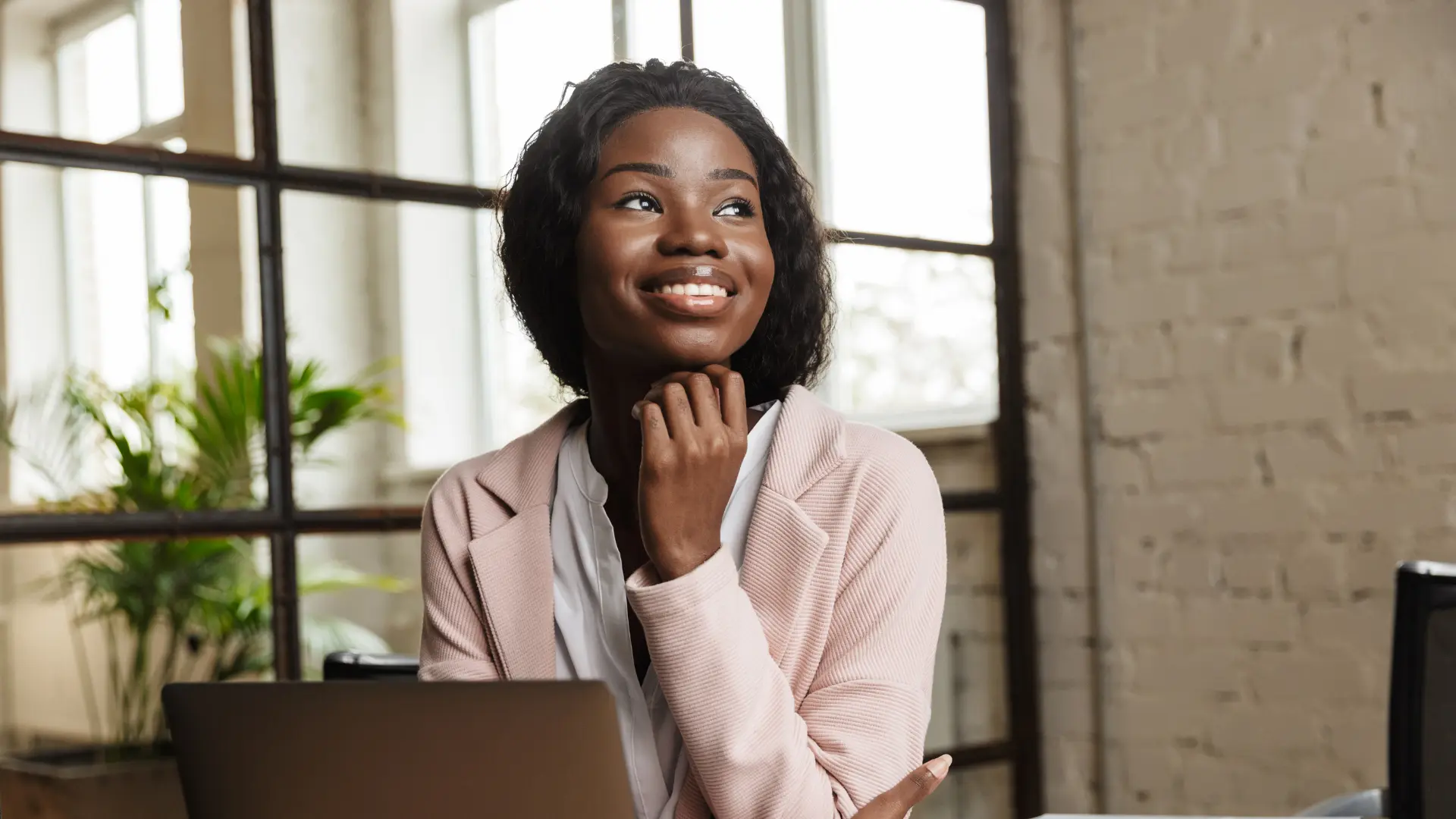 Professional woman reflecting on modern workplace and gender roles