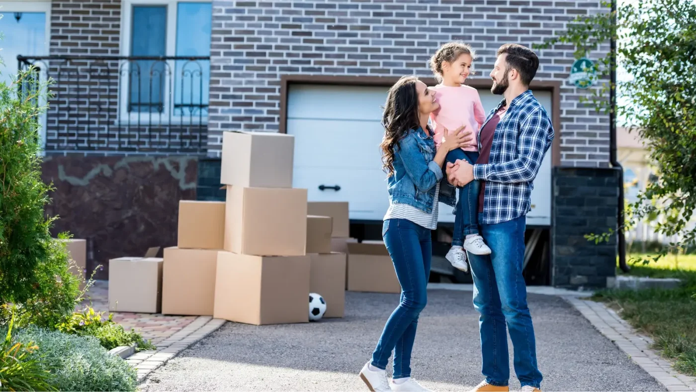Woman with her family moving into their new home after deciding between renting and buying a home