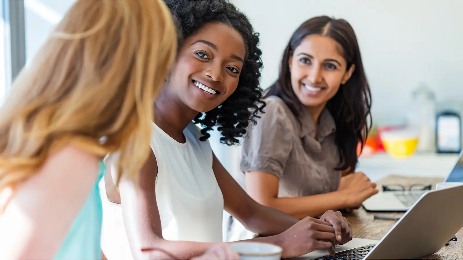 Working mom balancing remote work while caring for children at home