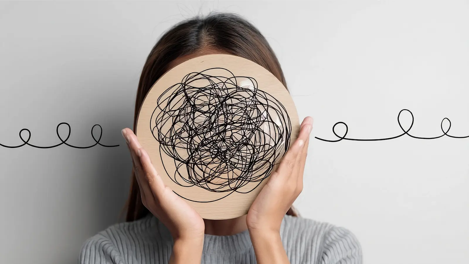 Overwhelmed mom managing mental load of family tasks and responsibilities