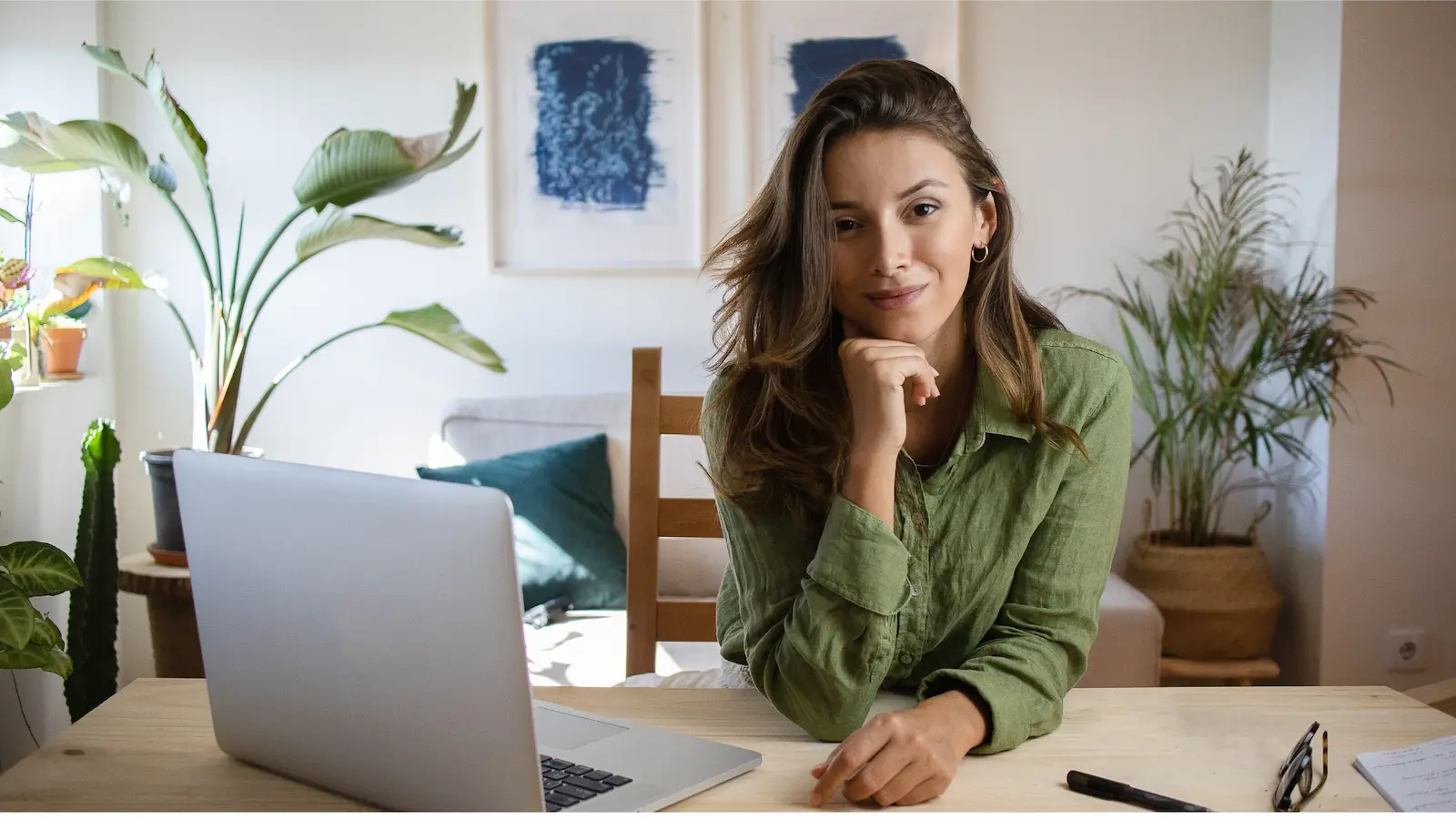 Exhausted working mom juggling laptop, kids and household responsibilities